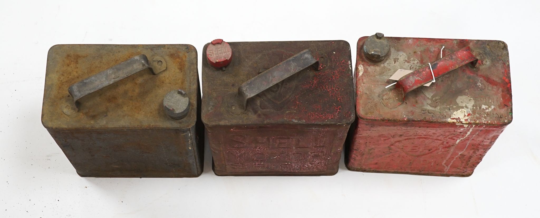 Three various petrol cans